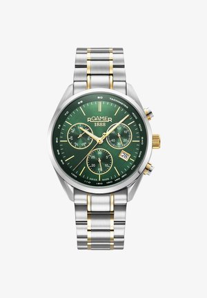 Srebrno-złoty stalowy zegarek z zieloną tarczą, trzema subtarczami, złotymi akcentami, oznaczeniami tachometru i wyświetlaczem daty o godzinie 6.