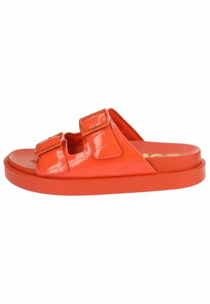Red slide sandal with a glossy finish, featuring two adjustable buckles, a cushioned footbed, and a thick platform sole.
