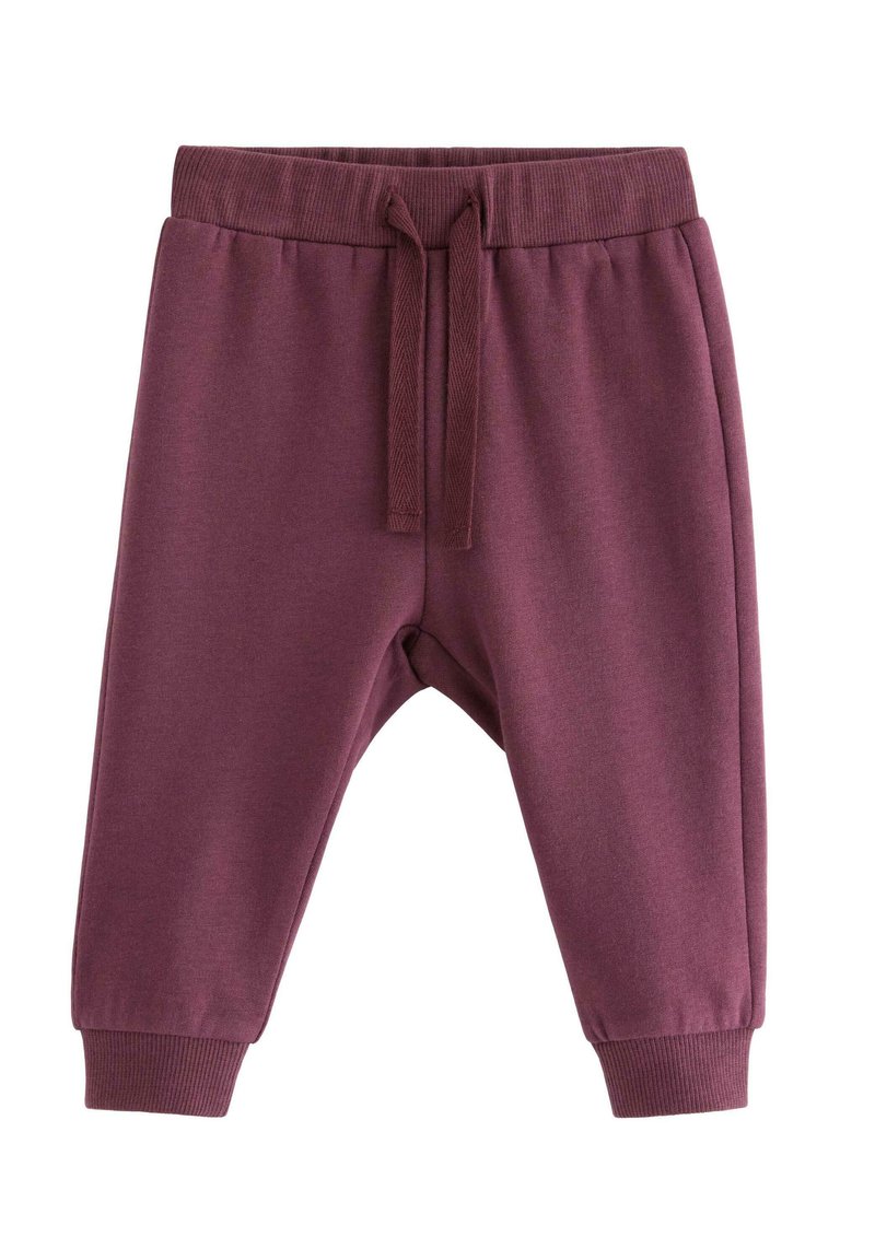 Mørkeburgunder sweatpants lavet af blødt stof, med elastisk talje og snoretræk samt tætsiddende manchetter ved anklerne.