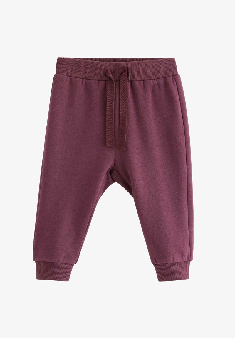 Mörk burgunderfärgade sweatpants i mjukt tyg, med elastisk midja med snörning och justerade muddar vid anklarna.