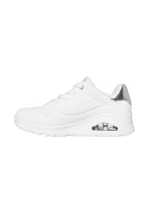 White athletic shoes with a smooth synthetic upper, silver accent on the heel, mesh perforations, and a cushioned sole featuring a visible air unit.