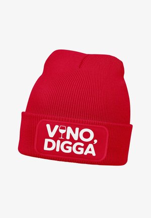 Red knit beanie with a folded cuff, featuring a white rectangular patch displaying the text “VINO, DIGGA” alongside a wine glass graphic.