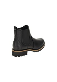 Stivaletto Chelsea in pelle nera con superiore testurizzato, pannelli elastici laterali, accentuazione marrone sulla suola e suola nera robusta.