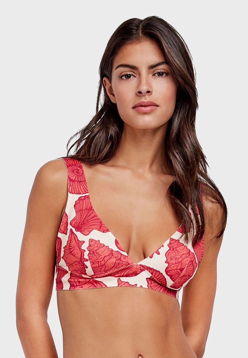Bralet s uzorkom crvenih školjki, s V-izrezom, širokim naramenicama i mekim, rastezljivim materijalom. Svijetla pozadina ističe detalje dizajna.
