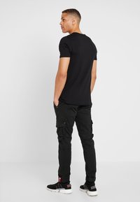Alpha Industries ARMY PANT - Kapsáče - black
