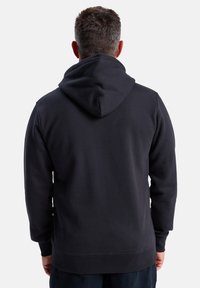 Dark gray hoodie with a fabric texture, featuring a hood and ribbed cuffs and hem. Back view shows smooth seam and minimalist design.