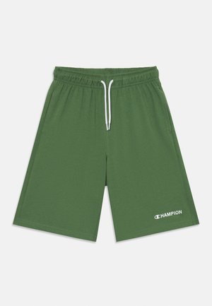 Zöld sportnadrág elasztikus derékpánttal, fehér húzózsinórral, és fehér "Champion" logóval az alsó bal oldalon.