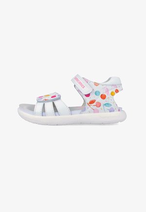 Sandalo bianco da bambino con motivi circolari multicolori, due cinturini regolabili e suola imbottita per comfort e supporto.