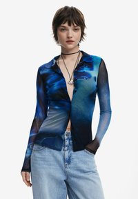 Long-sleeve shirt featuring a gradient blue design, made of sheer fabric with a button-up front and contrasting black accents.