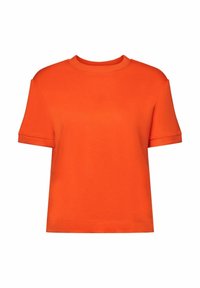 Lyhyt oranssi T-paita, valmistettu puuvillasta, jossa pyöreä pääntie ja lyhyet hihat. Yksinkertainen muotoilu ilman näkyviä kuvioita tai koristeita.