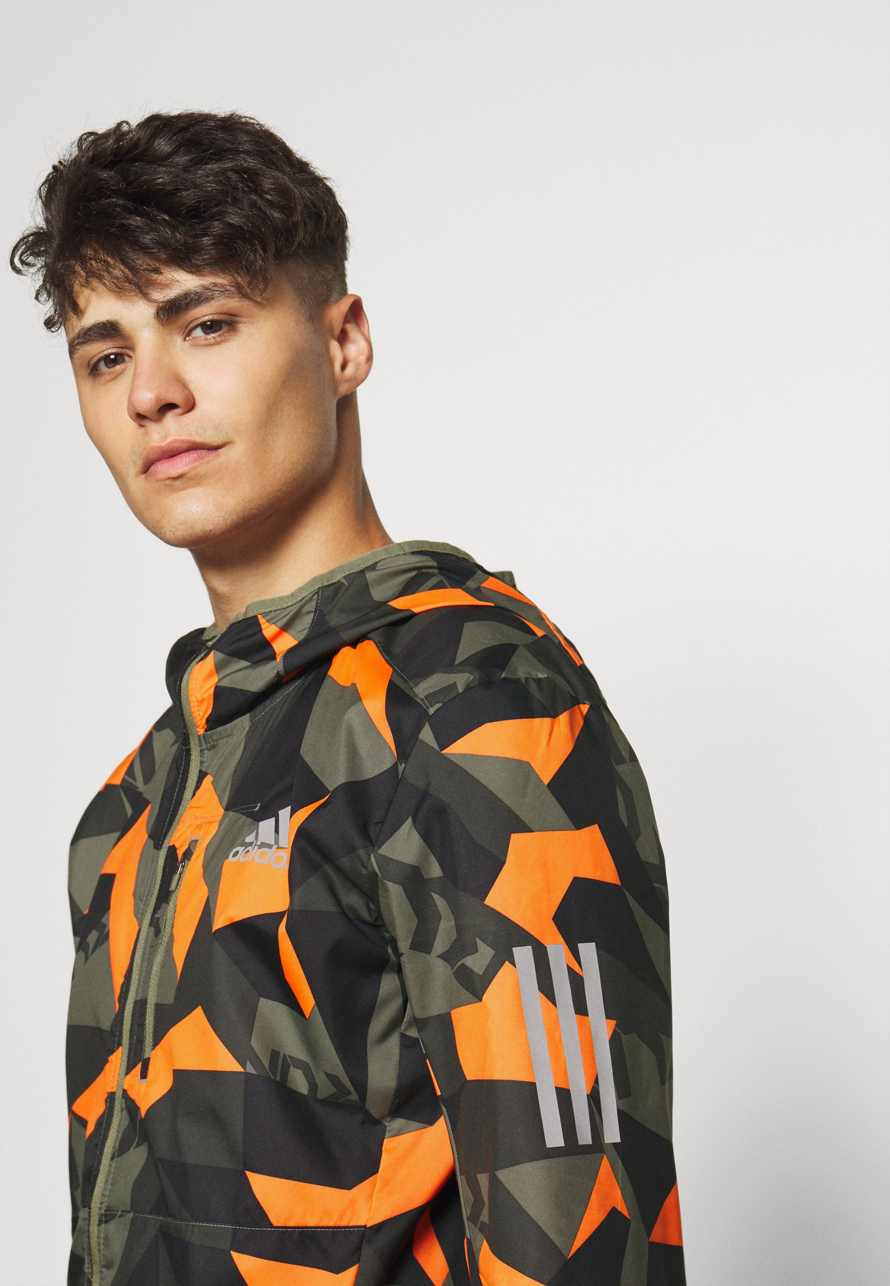 OWN THE RUN Laufjacke legacy greepp signal orangeblack OWN THE RUN Laufjacke legacy greepp signal orangeblack