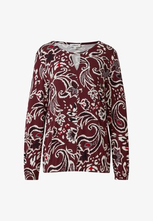 Long-sleeve maroon top with white, gray, and red floral and paisley patterns, and a small keyhole neckline cutout.