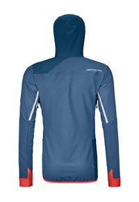 Blue softshell jacket with a hood, featuring red accents, zippered pockets, and a textured finish. Lightweight design suitable for outdoor use.