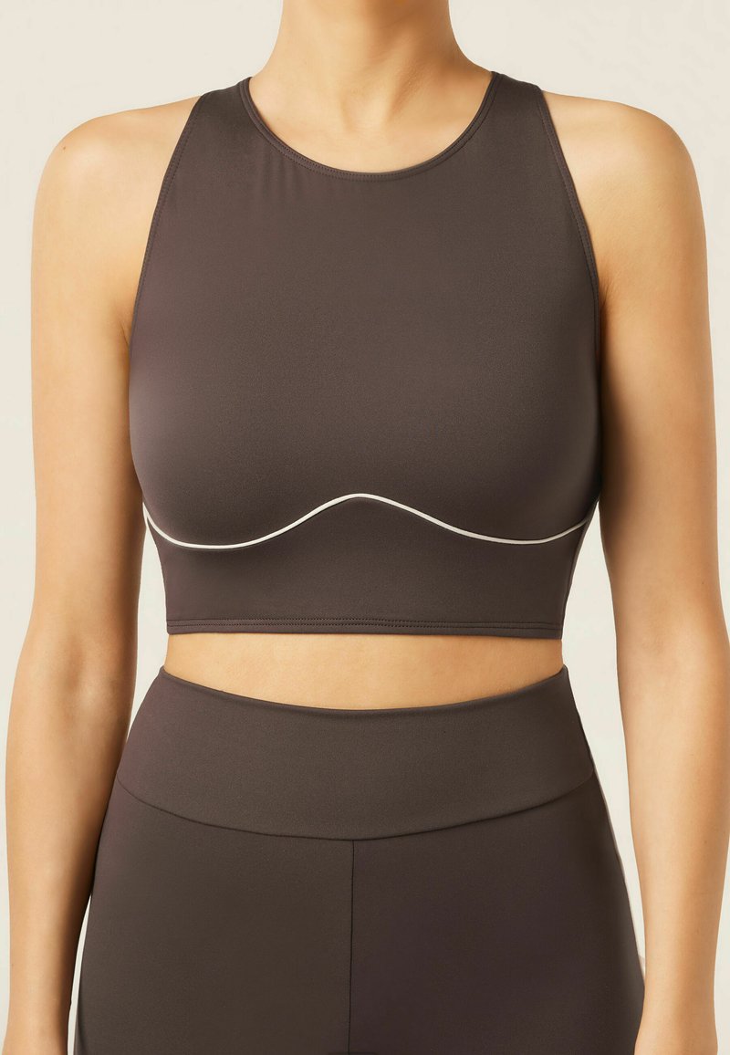 Dark brown cropped sports top with a round neckline and flat white accent line, featuring a smooth, stretchy texture.