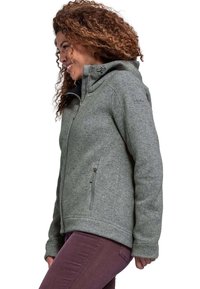 Graue Fleecejacke mit strukturierter Oberfläche, Reißverschlusstaschen und Kapuze. Bietet eine lockere Passform und Nähte entlang der Säume.