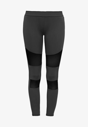 Svarta sportleggings med en åtsittande design, utrustade med genomskinliga meshpaneler på låren och under knäna, vilket ger en texturerad kontrast.