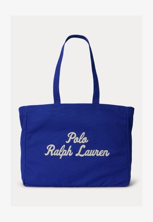 Modrá nákupná taška s dlhými rúčkami, na prednej strane s bielym vyšívaným nápisom „Polo Ralph Lauren“.