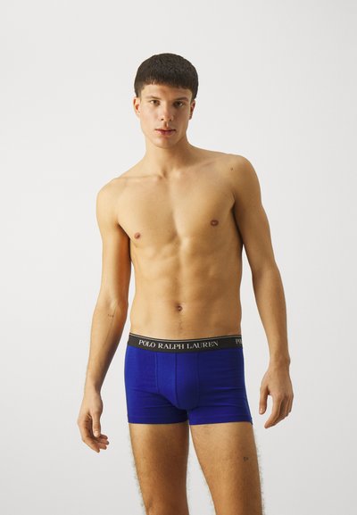 Vīriešu bokseršorti tumši zili no kokvilnas ar melnu elastīgu jostu, kurā ir "POLO RALPH LAUREN" logos, gluda tekstūra, pieguļoša forma.