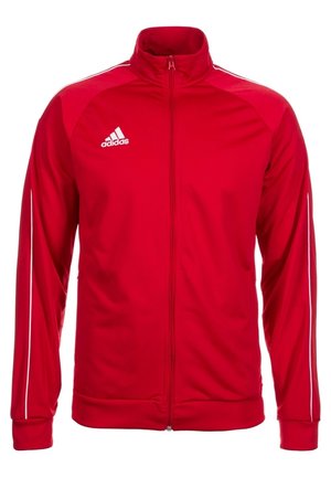 Veste de survêtement rouge Adidas avec fermeture éclair intégrale à l'avant, logo blanc sur la poitrine et bandes blanches le long des manches.