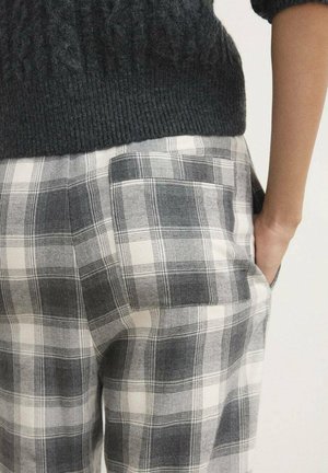 Geverfde broek met een mix van grijs en wit, met een gestructureerde tailleband en zijzakdetails.