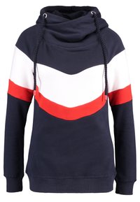 Felpa blu navy con strisce a forma di chevron bianca e rossa sul petto e sulle braccia superiori, caratterizzata da un colletto alto con lacci blu navy.