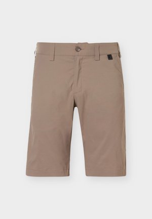 Μπεζ σορτς μήκους μέχρι το γόνατο με κούμπωμα με κουμπί και φερμουάρ, θηλιές για ζώνη και μπροστινές τσέπες σε μονόχρωμο φόντο.