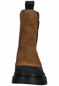Brown suede ankle boot with a black rubber sole and side elastic for easy entry. Features a pull tab on the shaft for convenient wear.