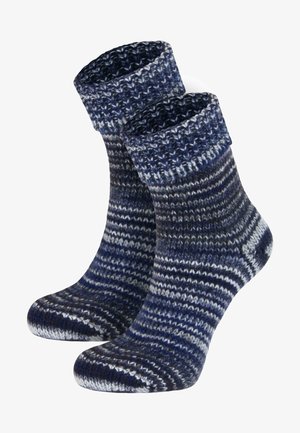 Knitted socks in blue and navy with a striped pattern. The fabric has a textured, soft appearance and a foldable cuff at the top.