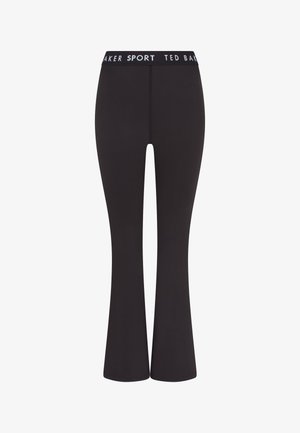 Leggings neri a palazzo realizzati in tessuto elasticizzato, con una cintura bianca con logo. Texture liscia e silhouette aderente.