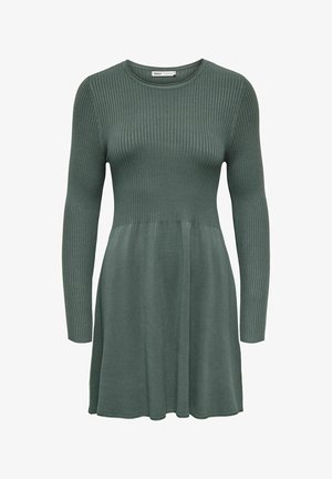 Ribota megzta suknelė prislopintos žalios spalvos, su ilgomis rankovėmis, prigludusia liemene ir platėjančia sijona, baigiančia virš kelių. Sklandus paviršius.