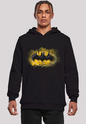 Black hoodie featuring a central yellow and black Batman logo. Cotton blend material with a front pocket and adjustable drawstring hood.