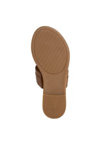 Brun sandal med sula som har ett texturerat greppmönster, något upphöjd klack och sidoremmar. Slät yta med rund tå. Storlek angiven som 37.