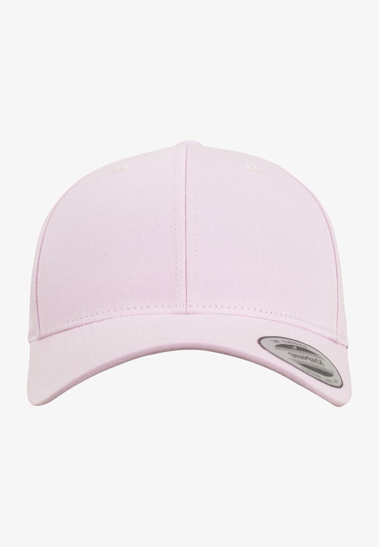 Pink cotton baseball cap with a curved visor, six ventilation eyelets, and a textured finish. Features a circular logo sticker on the brim.