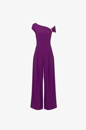 Combinaison violette une épaule avec pantalon large et détail d’un nœud en tissu sur l’épaule.