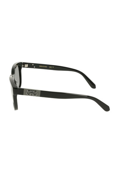 Black sunglasses with a glossy finish, thick frames, and a distinctive logo accent on the temples. Straight arms taper towards the tips.
