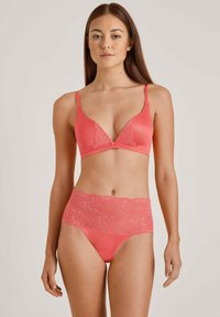 Coral lace and satin bralette with a V-shaped neckline and adjustable straps, paired with matching high-waisted brief featuring a lace band.