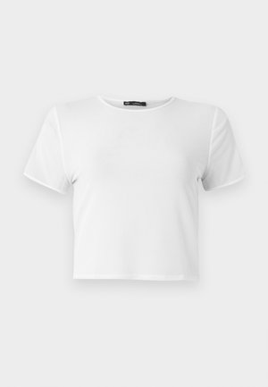 T-shirt blanc court avec des manches courtes, un col rond et une texture lisse. Couture renforcée le long des bords. Design simple, sans motifs.