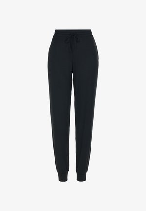 Czarne spodnie dresowe wykonane z miękkiego, elastycznego materiału. Elastyczny pas ze sznurkiem, zwężane nogawki oraz żebrowane mankiety przy kostkach.