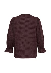 Blouse à manches longues violet foncé avec une petite texture à pois, des poignets élastiques à volants et des détails froncés aux épaules, vue de dos.