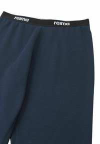 Navy athletic leggings with a textured fabric, featuring a black elastic waistband branded with "reima" in white lettering.