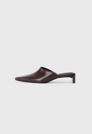 Burgundy leather mules with a pointed toe and a short block heel, featuring a smooth texture and open back design.