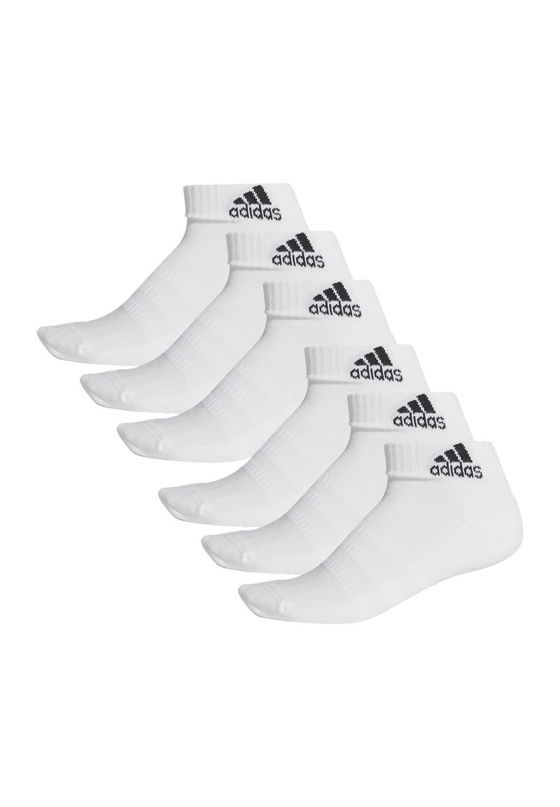 White athletic socks featuring a ribbed cuff, black Adidas logo, and a short design. Six pairs are displayed in a row.