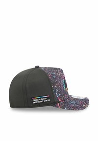 Cap featuring a black base with a multicolored splatter pattern. Includes a "Crucial Catch: Intercept Cancer" label on the side.