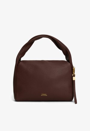 Dark brown pebbled leather handbag with padded handle, gold zipper pull, and small gold "Tommy Hilfiger" logo on front.