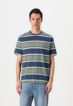 Cotton T-shirt featuring blue and green horizontal stripes, a crew neck, short sleeves, and a small logo tag at the hem.
