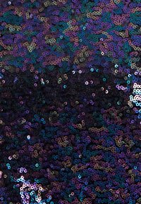 Sequin fabric featuring a gradient of black, purple, and teal. Round, shiny sequins reflect light with a colorful shimmer.
