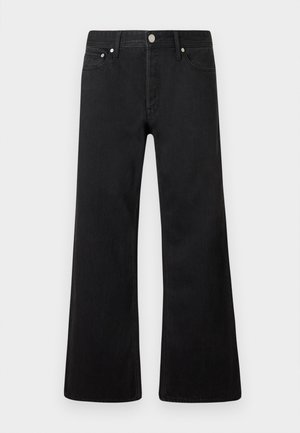 Mustat leveälahkeiset farkut, joissa on klassinen viiden taskun muotoilu, valmistettu denim-kankaasta. Varustettu hopeisilla yksityiskohdilla ja puhtaalla, sileällä pinnalla.