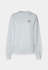 Felpa azzurra chiaro con scollatura rotonda e maniche lunghe. Presenta un piccolo logo di un uccellino giallo sul petto e polsini a costine.