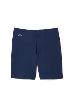 Pantalones cortos azul marino confeccionados en una tela suave con frente plano, bolsillos laterales y un pequeño logo verde de Lacoste en la parte delantera izquierda.
