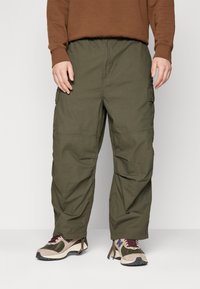 Carhartt WIP JET PANT - Hlačami s stranskimi žepi - cypress rinsed
